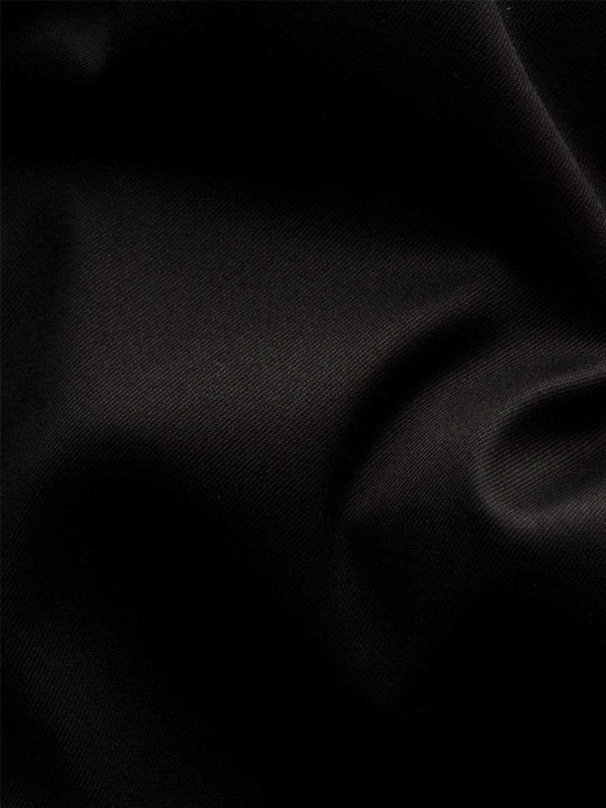 Close-up of the Eton Contemporary Fit Solid Signature Twill Dress Shirt in Black with French cuffs, highlighting its textured organic cotton fabric and subtle folds that create elegant shadow and light play.