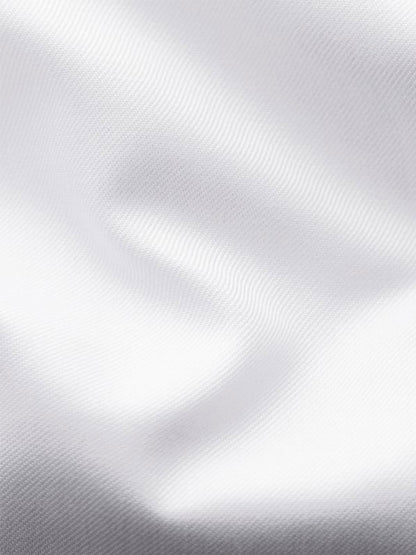 Close-up of the smooth, white signature twill fabric from the Eton Contemporary Fit Solid Signature Twill Dress Shirt in White - French Cuff, with soft folds and subtle shadows highlighting its luxurious organic cotton texture.