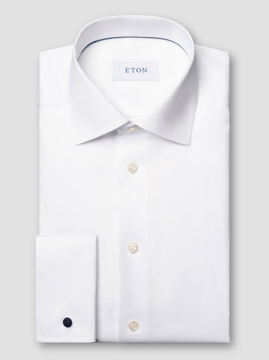 The Eton Contemporary Fit White French Cuff Dress Shirt features an optic white color, spread collar, pearl buttons, French cuffs, and "ETON" branding on the inside collar label.