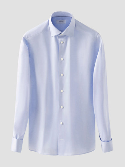 The Eton Contemporary Fit Solid Signature Twill Dress Shirt in light blue features French cuffs and is displayed on a plain grey background.