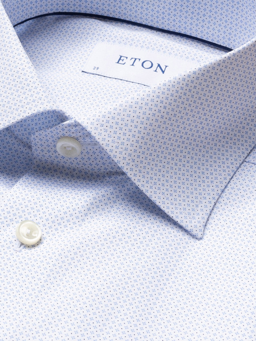 Close-up of the Eton Contemporary Fit Sky Blue Micro Print Dress Shirt in fine poplin, featuring a buttoned collar and white buttons.