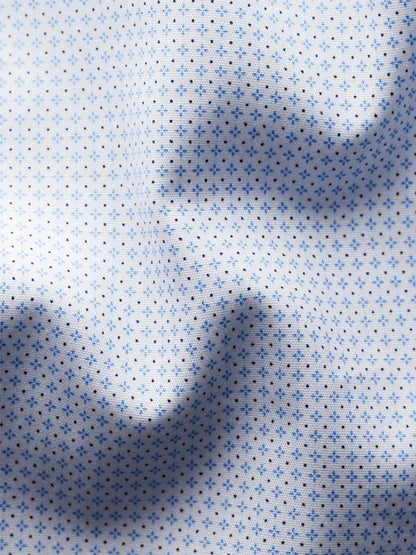 Close-up of the Eton Contemporary Fit Sky Blue Micro Print Dress Shirt, made from white fine poplin with small blue polka dots and visible folds creating subtle shadows—showcasing modern style.