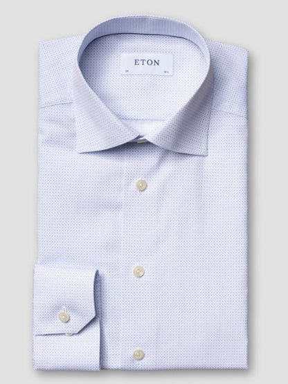 A folded Eton Contemporary Fit Sky Blue Micro Print Dress Shirt, buttoned with a spread collar and subtle pattern, is displayed on a plain background. The label inside reads "ETON.