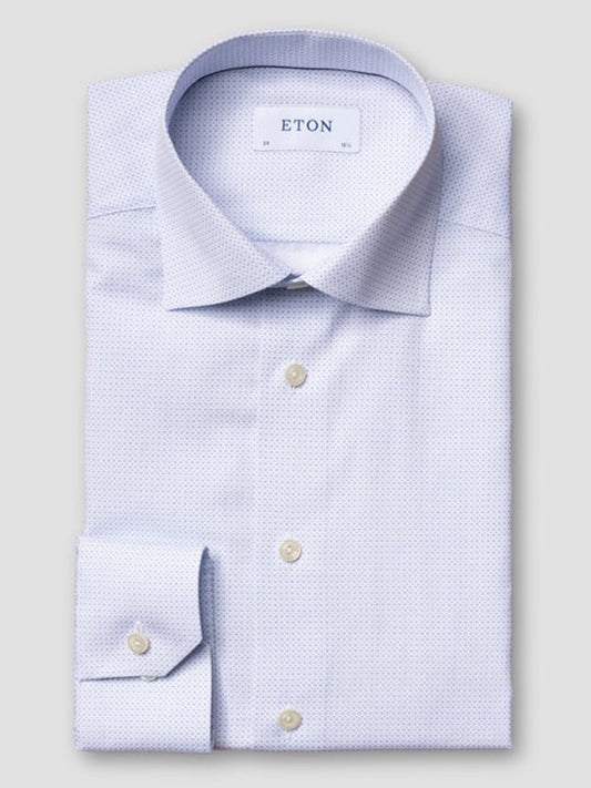 A neatly folded Eton Slim Fit Sky Blue Micro Print Dress Shirt with cream buttons and a subtle pattern, featuring the "ETON" label on the collar.