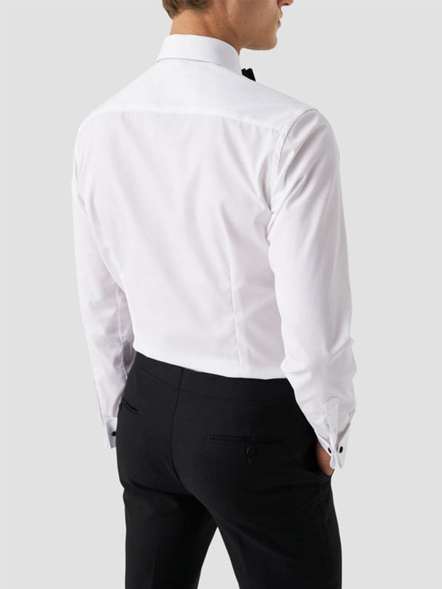 A man is seen from behind wearing the Eton Contemporary Fit Plissé Black Tie Dress Shirt, set against a plain light gray background.