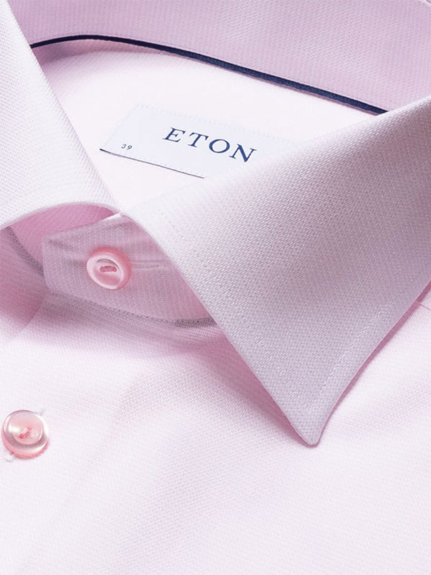 Close-up of the Eton Contemporary Fit Semi Solid Piping Details Dress Shirt in Pink, featuring a pointed collar, pink buttons, and visible ETON label.