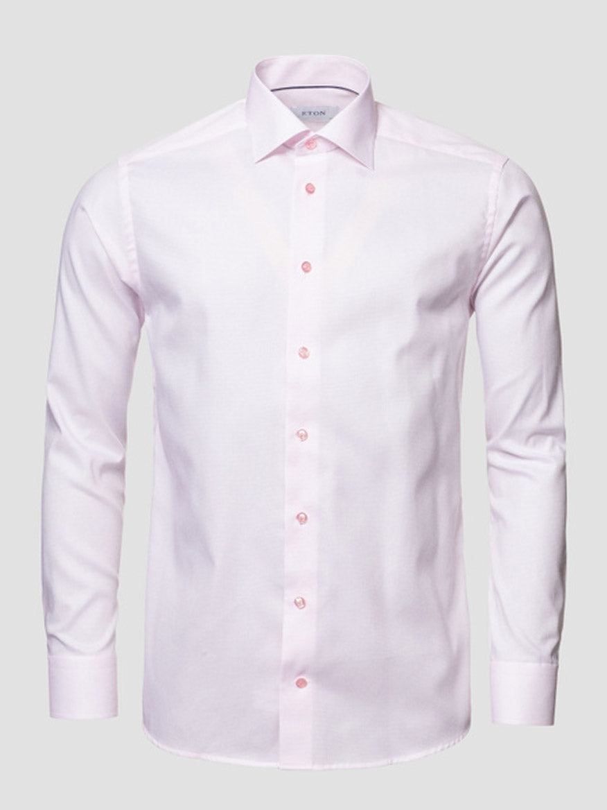 The Eton Contemporary Fit Semi Solid Piping Details Dress Shirt in Pink features long sleeves and a classic collar, shown against a plain gray background.