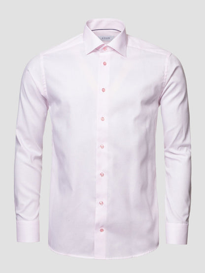 The Eton Contemporary Fit Semi Solid Piping Details Dress Shirt in Pink features long sleeves and a classic collar, shown against a plain gray background.