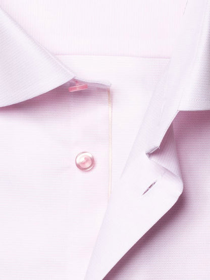 Close-up of the Eton Contemporary Fit Semi Solid Piping Details Dress Shirt in Pink, highlighting the collar, a single button, and part of the button placket.