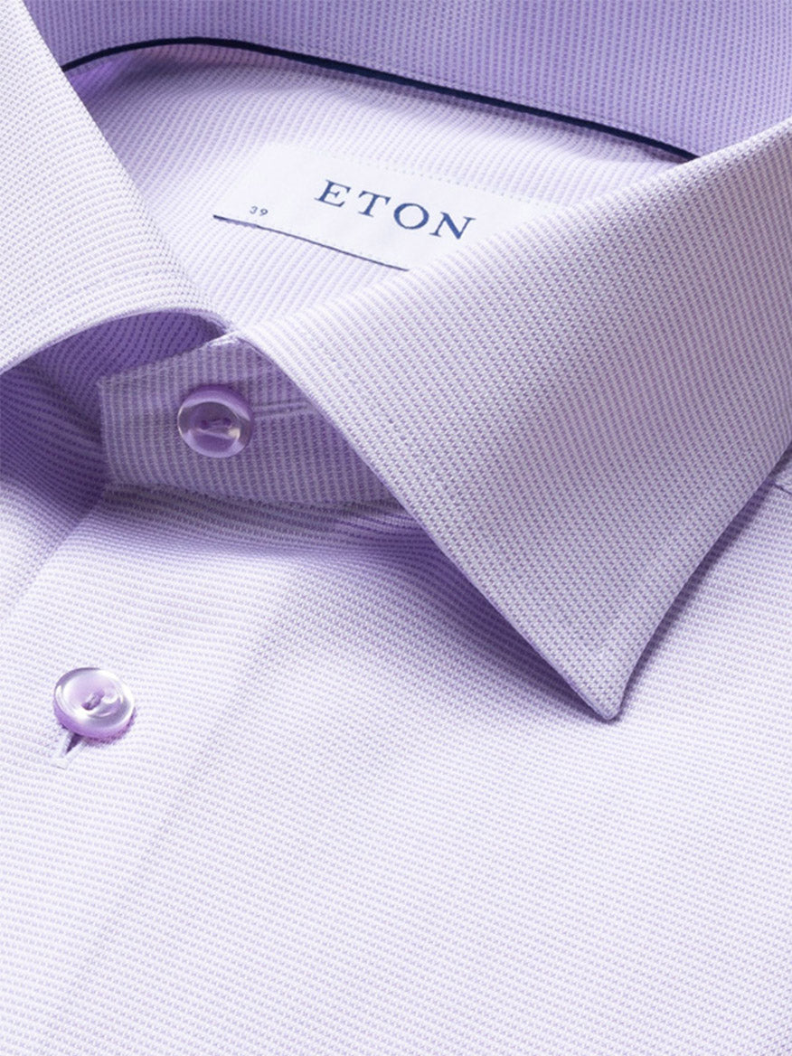 Close-up of an Eton Slim Fit Semi Solid Piping Details Shirt in light purple, featuring button accents and a classic collar. The label inside the collar reads "ETON.