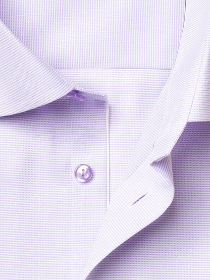 Close-up of the Eton Slim Fit Semi Solid Piping Details Shirt in light purple, featuring a cutaway collar, button, part of the placket, and a subtle textured pattern.