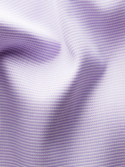 Close-up of the Eton Contemporary Fit Semi Solid Piping Details Dress Shirt in Light Purple, showing ribbed fabric with small horizontal ridges and subtle folds that emphasize its unique texture and modern pattern.