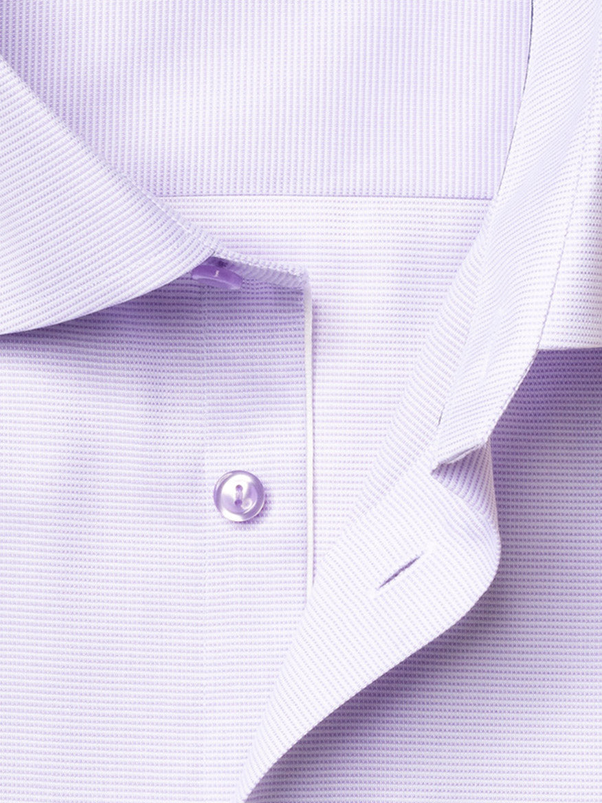 Close-up of the Eton Contemporary Fit Semi Solid Piping Details Dress Shirt in Light Purple, showcasing its cut away collar, button, and placket with fine textured fabric.