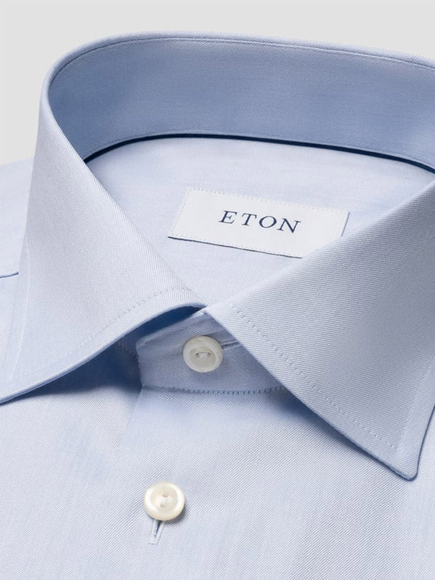 Close-up of the Eton Contemporary Fit Light Blue Signature Twill Dress Shirt, featuring white buttons and an inner collar label reading "ETON.
