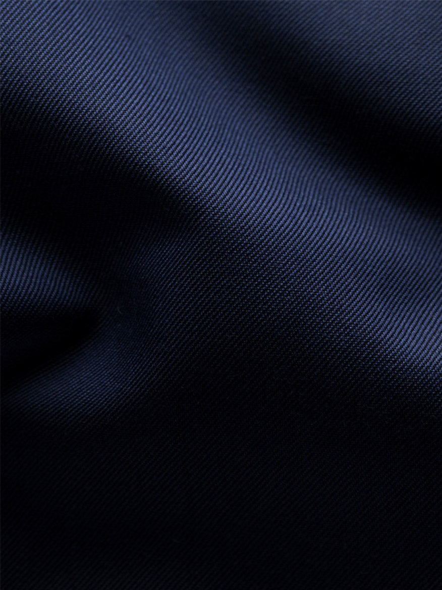 Close-up view of the Eton Slim Fit Solid Signature Twill Dress Shirt in Navy Blue, showcasing its dark blue signature twill fabric with a visible diagonal weave pattern and soft folds.