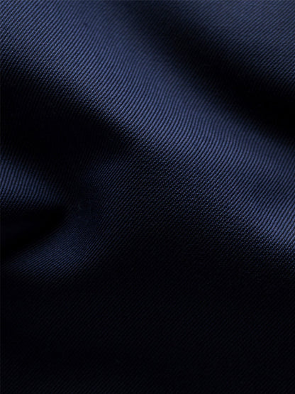 Close-up view of the Eton Slim Fit Solid Signature Twill Dress Shirt in Navy Blue, showcasing its dark blue signature twill fabric with a visible diagonal weave pattern and soft folds.