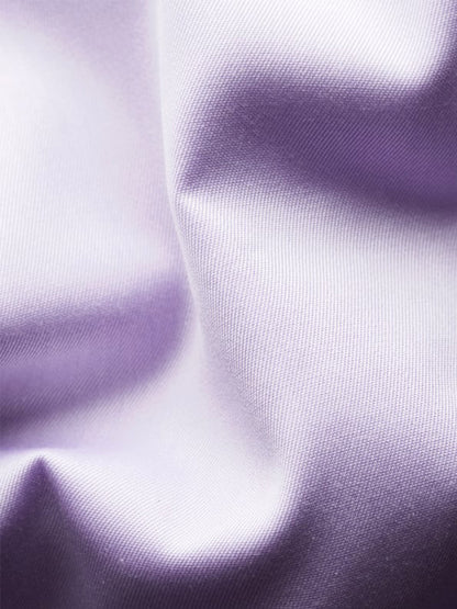 Close-up of smooth, mid purple fabric with soft folds—perfect inspiration for the Eton Slim Fit Solid Signature Twill Dress Shirt in Mid Purple, ideal for an elegant, wrinkle-free business look.