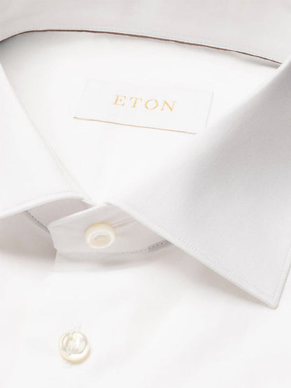 Close-up of the Eton Contemporary Fit Solid Elevated Twill Dress Shirt in White, featuring a sharp collar and visible Eton brand label inside the neckline.