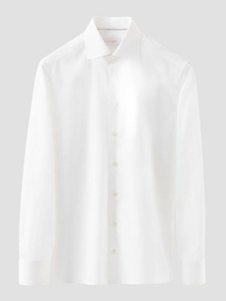 The Eton Contemporary Fit Solid Elevated Twill Dress Shirt in White features long sleeves and a collar, shown against a light gray background.