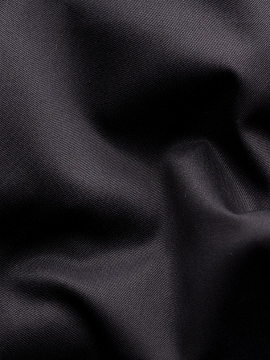 Close-up of black, crease-resistant fabric with soft, smooth texture—crafted from premium organic Supima cotton for the Eton Contemporary Fit Solid Elevated Twill Dress Shirt in Black.