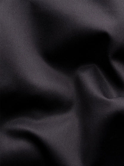 Close-up of black, crease-resistant fabric with soft, smooth texture—crafted from premium organic Supima cotton for the Eton Contemporary Fit Solid Elevated Twill Dress Shirt in Black.