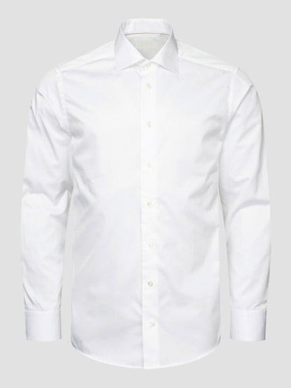 The Eton Slim Fit Solid Elevated Twill Dress Shirt in White is crafted from organic Supima cotton with a spread collar and crease-resistant finish, shown against a light gray background.