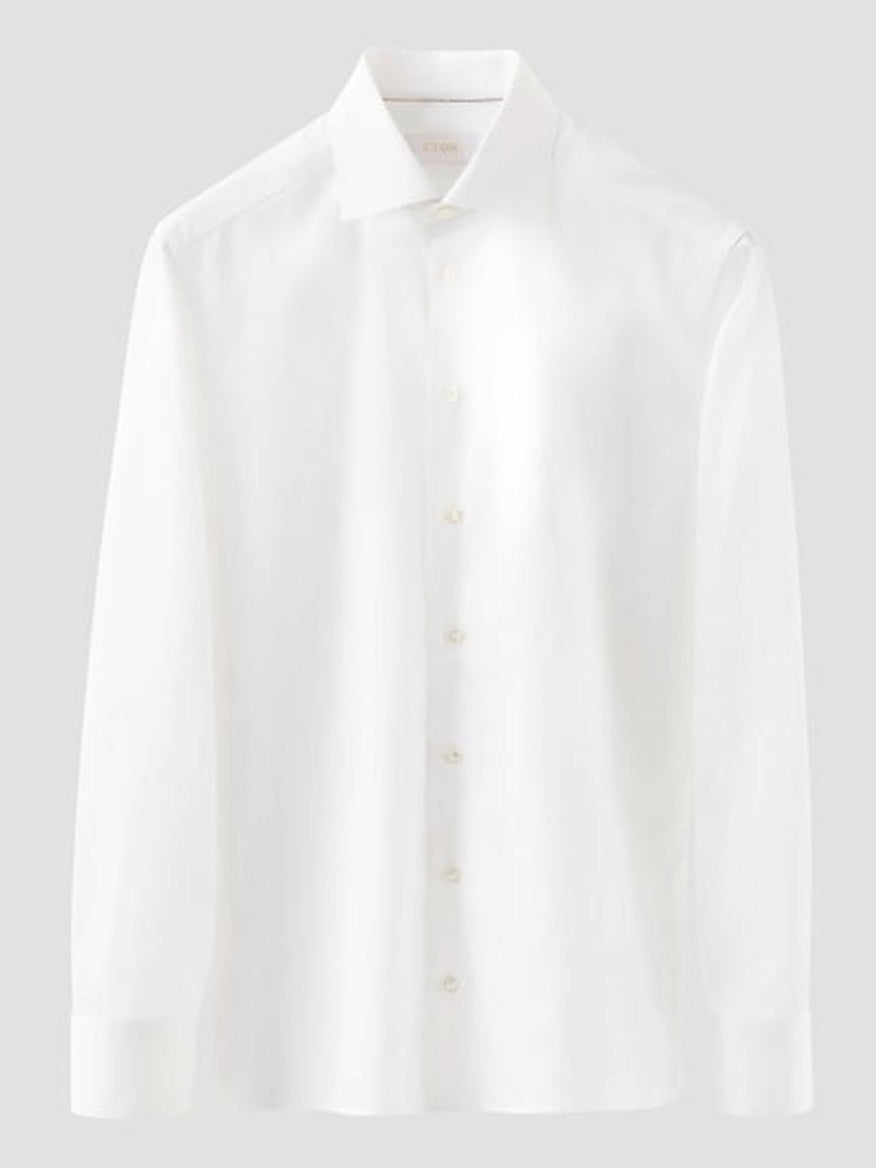 The Eton Slim Fit Solid Elevated Twill Dress Shirt in White, featuring a collar and long sleeves, is crafted from organic Supima cotton and displayed on a neutral gray background.