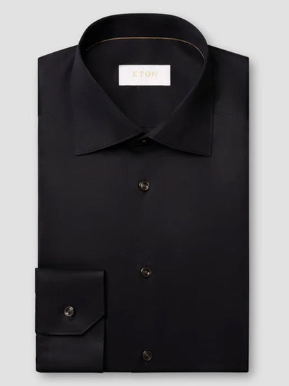 Eton Slim Fit Solid Elevated Twill Dress Shirt in black, featuring long sleeves, a spread collar, a wrinkle-resistant finish, and buttoned cuffs.