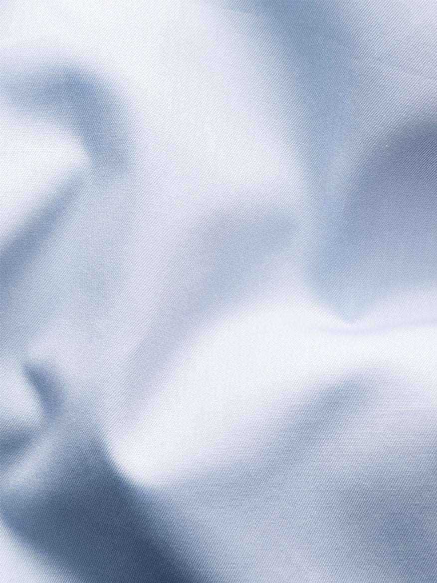 Close-up of the Eton Slim Fit Solid Elevated Twill Dress Shirt in Light Blue, featuring crease-resistant organic Supima cotton with a visible textured weave and gentle folds—perfect for a refined dress shirt look.