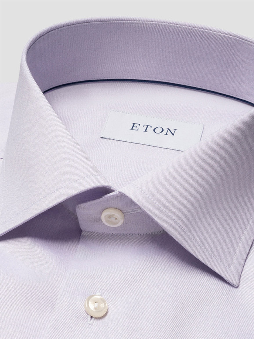 Close-up of the Eton Contemporary Fit Solid Signature Twill Dress Shirt in mid purple, featuring white buttons and an "ETON" label inside the collar.