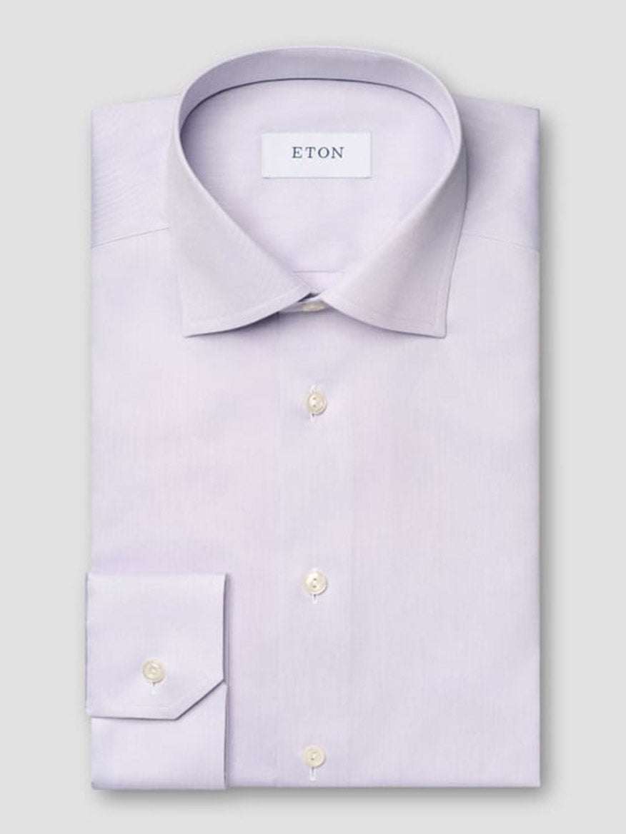 A neatly folded Eton Contemporary Fit Solid Signature Twill Dress Shirt in Mid Purple, with white buttons, classic collar, and visible "ETON" label inside.