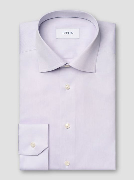 A neatly folded Eton Contemporary Fit Solid Signature Twill Dress Shirt in Mid Purple, with white buttons, classic collar, and visible "ETON" label inside.