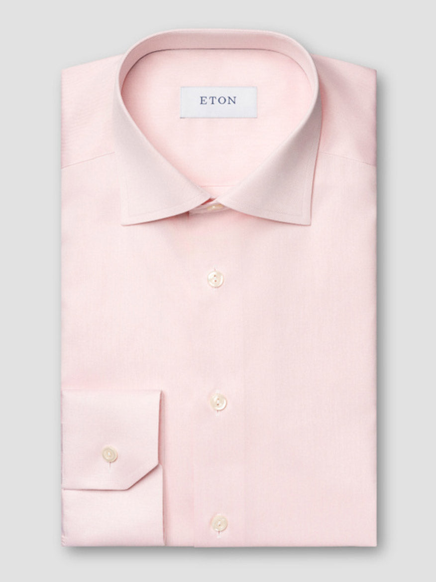 The Eton Contemporary Fit Solid Signature Twill Dress Shirt in Pink features a classic collar, buttoned cuffs, and the Eton label inside.