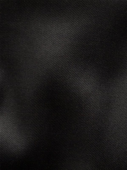 Close-up of black organic Supima cotton fabric with a subtle diagonal weave, softly lit to reveal highlights—ideal for the Eton Slim Fit Solid Signature Twill Dress Shirt in Black with cut away collar, crease-resistant and refined.