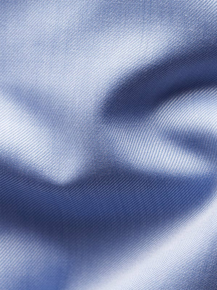 Close-up of the Eton Slim Fit Solid Signature Twill Dress Shirt in Light Blue, featuring a visible weave pattern and soft folds—ideal for a wrinkle-free, polished business look with French cuffs.