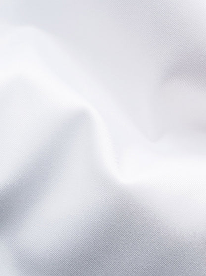 Close-up of the Eton Slim Fit Solid Signature Twill Dress Shirt in white with navy details, featuring visible texture and gentle folds, plus an extreme cut away collar.