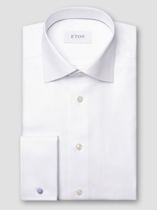 The Eton Contemporary Fit Solid Textured Twill Dress Shirt in White features a classic collar, button front, French cuffs, and is made from organic cotton with the ETON label inside the collar.