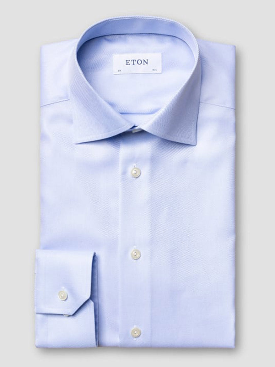 The Eton Contemporary Fit Solid Textured Twill Dress Shirt in Light Blue features organic cotton, a spread collar, button cuffs, and displays the Eton label inside the collar.