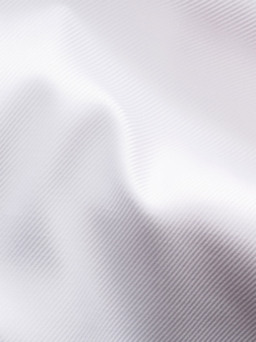 Close-up of Eton Slim Fit Solid Textured Twill Dress Shirt in White, featuring an extreme cut away collar and subtle diagonal lines for a smooth, refined finish—perfect for sophisticated business attire.