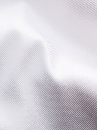 Close-up of Eton Slim Fit Solid Textured Twill Dress Shirt in White, featuring an extreme cut away collar and subtle diagonal lines for a smooth, refined finish—perfect for sophisticated business attire.