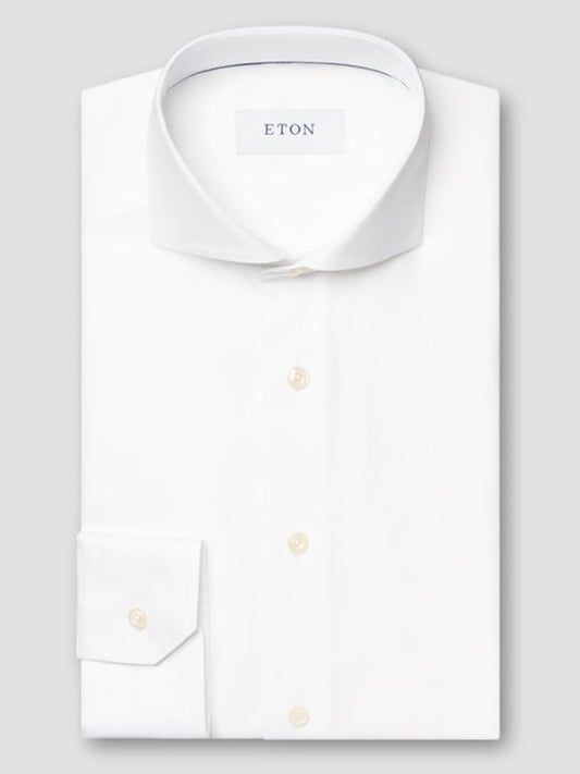 The Eton Slim Fit Solid Textured Twill Dress Shirt in White features an extreme cut away collar, shown neatly folded on a light gray background—ideal for a sharp, modern business look.