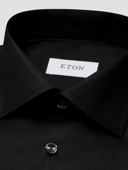 Close-up of the Eton Contemporary Fit Black Signature Twill Dress Shirt label sewn inside the collar, showcasing its modern style.