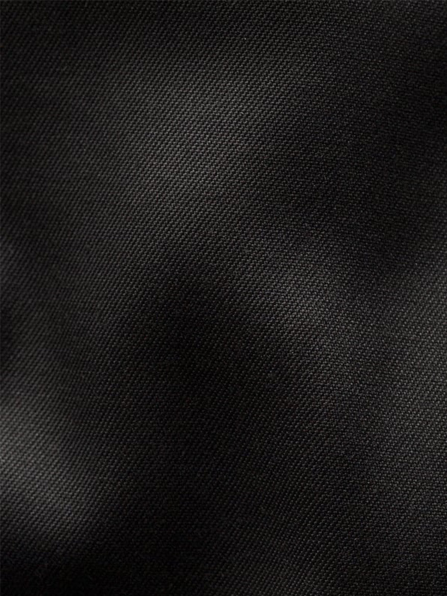 Close-up of Eton Contemporary Fit Black Signature Twill Dress Shirt, showcasing its subtle diagonal weave. Soft lighting highlights the wrinkle-resistant black fabric, making it ideal for a formal look.