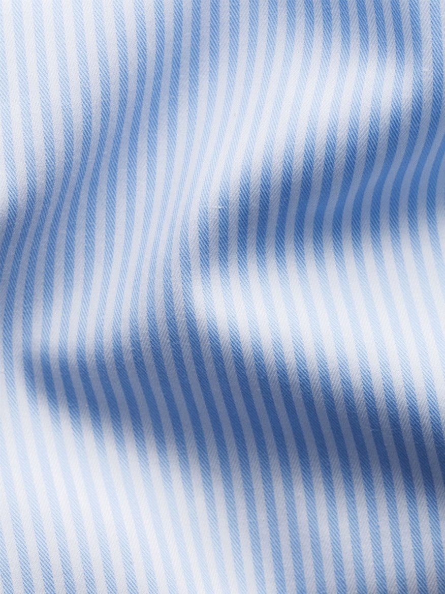 Close-up of the Eton Slim Fit Striped Fine Twill Dress Shirt in Light Blue with a cut away collar, featuring light blue and white bengal stripes and subtle folds—ideal for a sharp, modern look.