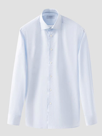 Eton Slim Fit Striped Fine Twill Dress Shirt in light blue, featuring a cut away collar and long sleeves, shown on a plain grey background.