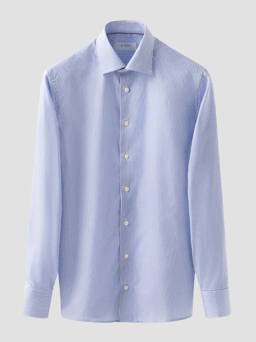 The Eton Slim Fit Striped Fine Twill Dress Shirt in Mid Blue features a cut away collar and fine stripes, showcased against a plain background.