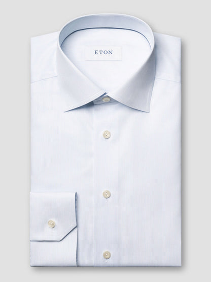 The Eton Contemporary Fit Striped Twill Dress Shirt in Light Blue features crease-resistant cotton, a classic collar, and white buttons—the perfect choice to keep you looking sharp all day.