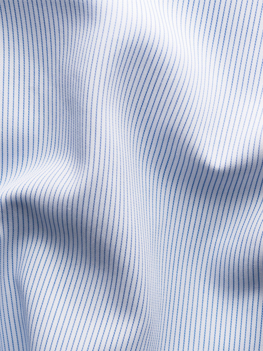 Close-up of the Eton Contemporary Fit Striped Twill Dress Shirt in Dark Blue, featuring soft white cotton twill with thin blue vertical pinstripes and subtle folds—ideal for a timeless, polished look.