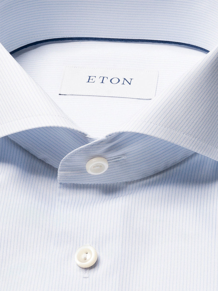 Close-up of the Eton Slim Fit Striped Twill Dress Shirt in Light Blue, featuring crease-resistant cotton twill, white buttons, and a visible Eton label inside the collar.