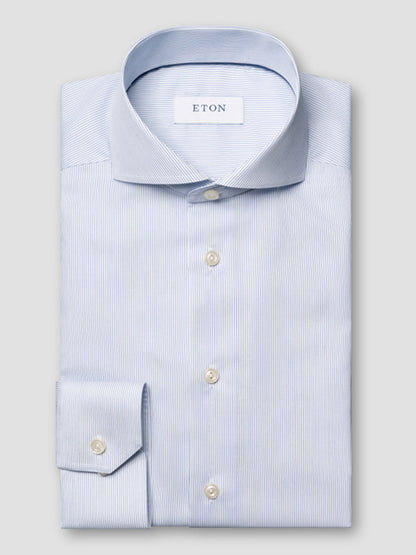The Eton Slim Fit Striped Twill Dress Shirt in dark blue features an extreme cut away collar and is displayed against a plain gray background.
